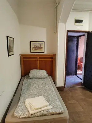 a bed sitting in a room with at MAGENTA Apartments in Belgrade