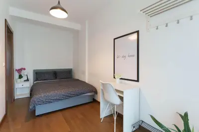 a bedroom with a bed and a desk at Zemunske Kapije in Belgrade