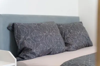 two pillows sitting on top of a bed at Zemunske Kapije in Belgrade
