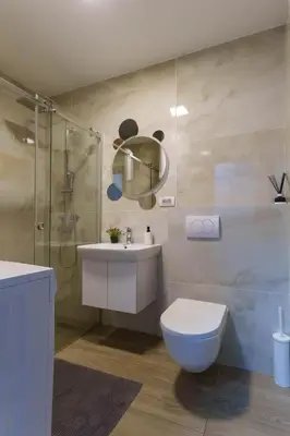 a bathroom with a toilet and a sink and a shower at Zemunske Kapije in Belgrade