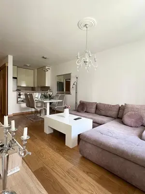 a living room with a couch and a table at Zemunske Kapije in Belgrade