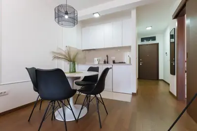 a kitchen and dining room with a table and chairs at Zemunske Kapije in Belgrade