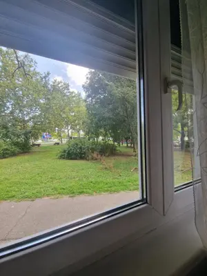 a window with a view of a yard at Apartment Iskra in Belgrade