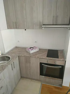 a kitchen with a sink and a counter top at SUMICE apartment in Belgrade