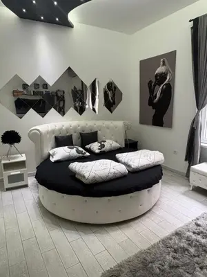 a bedroom with a large bed with pillows on it at LUX apartment in downtown of Belgrade in Belgrade