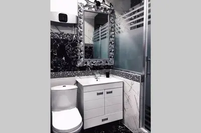 a bathroom with a toilet and a sink and a mirror at LUX apartment in downtown of Belgrade in Belgrade