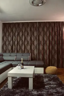 a living room with a couch and a table at Ramonda Residences - New Belgrade in Belgrade