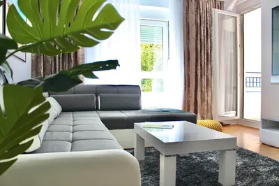a living room with a couch and a table at Ramonda Residences - New Belgrade in Belgrade
