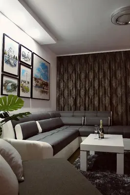 a living room with a couch and a table at Ramonda Residences - New Belgrade in Belgrade
