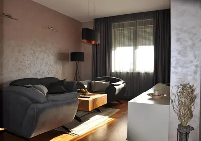 a living room with a couch and a table at Apartman Lola in Vračar (historical)