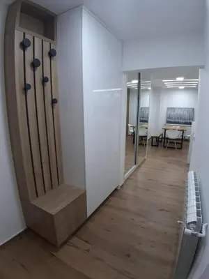 an office hallway with a staircase and a table at Serbian home, Gandijeva 162, free parking in Belgrade