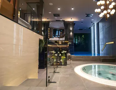 a bathroom with a jacuzzi tub in a room at Marconio Wellness Private Pool & SPA - City Center in Belgrade