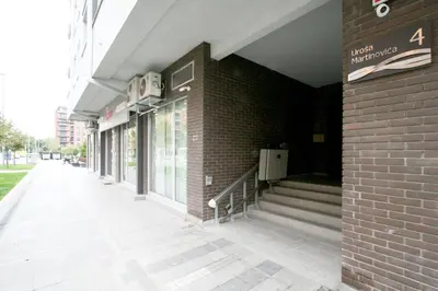 a brick building with a sign on the side of it at Apartment Moonstone 1 in Belgrade