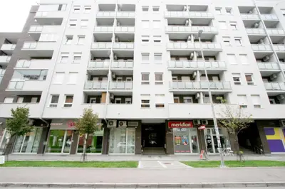 an apartment building on the corner of a street at Apartment Moonstone 1 in Belgrade