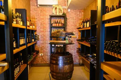 a wine tasting room with a barrel in the middle at MV Monogram in Inđija