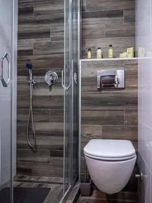 a bathroom with a toilet and a glass shower at GOFD Apartman in Belgrade
