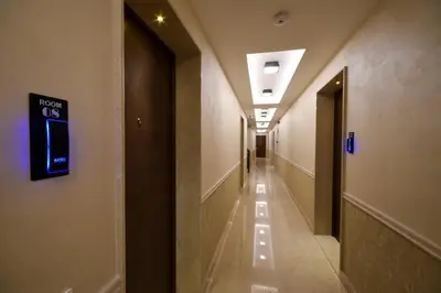 a hallway of a building with a sign on the wall at Hotel LoRa in Belgrade