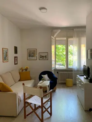 a living room with a couch and a table at City centre apartment in Belgrade