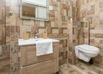 a bathroom with a toilet and a sink and a mirror at Studio 138 in Belgrade
