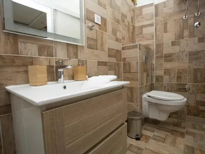 a bathroom with a sink and a toilet at Studio 138 in Belgrade