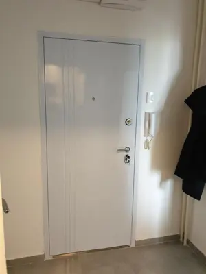 a white door in the corner of a room at TiTo LuX in Belgrade