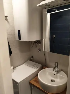 a small bathroom with a toilet and a sink at TiTo LuX in Belgrade