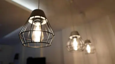 three lights are hanging from a ceiling in a room at Vilovski in Vračar (historical)