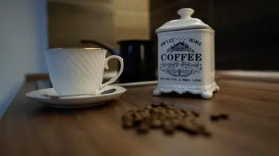 a cup of coffee sitting next to a cup of coffee on a table at Vilovski in Vračar (historical)