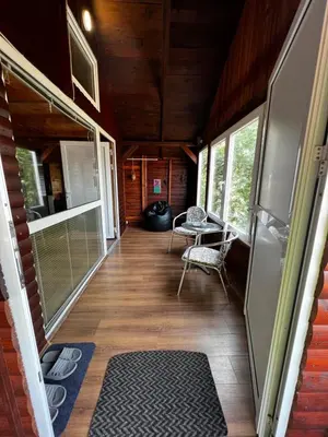 a hallway of a house with a table and chairs at Kuca i splav na reci Savi in Belgrade