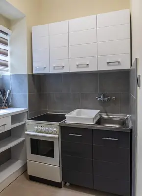 a kitchen with a sink and a stove at Dixy apartman in Belgrade