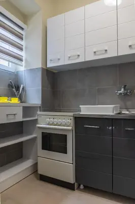 a kitchen with a stove and a sink at Dixy apartman in Belgrade