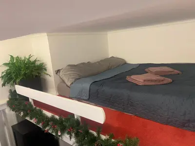 a bed in a room with christmas decorations at Old Town City Center in Belgrade