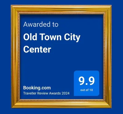 an image of a gold picture frame with the words upgraded to old town city center at Old Town City Center in Belgrade