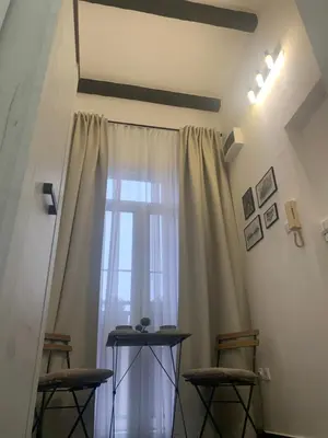 a room with a window with two chairs and a table at Old Town City Center in Belgrade