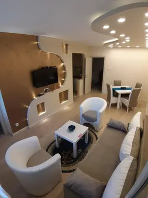 a living room with a couch and chairs and a table at Danube Blue 2 in Belgrade