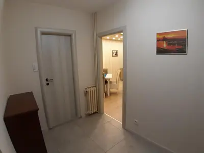 a hallway with a door leading to a dining room at Danube Blue 2 in Belgrade