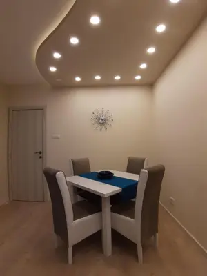 a dining room with a table and chairs at Danube Blue 2 in Belgrade