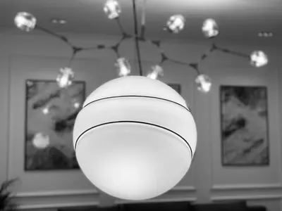 a large white ball hanging from a ceiling with lights at Luxury Apartments Donostia & Iruña in Belgrade