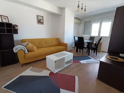 a living room with a couch and a table at Apartment Dorcol in Belgrade