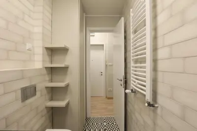 a bathroom with a toilet and a walk in shower at Belgrade Center Apartment VI in Belgrade