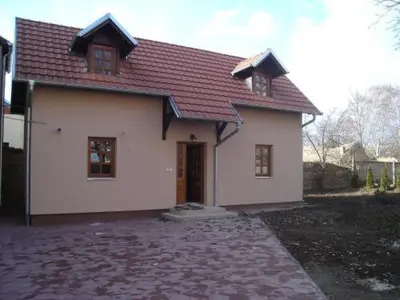 a small white house with a red roof at Rooms Milin Lagum in Irig