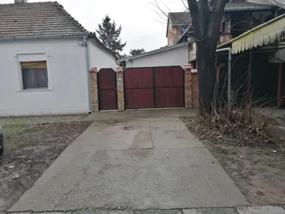a driveway in front of a house with a garage at DEP House in Zemun