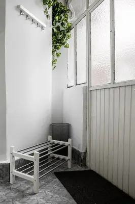 a room with a bench next to a door at 4Seasons in Sajmište