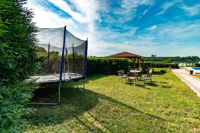 a tent in the grass with a table and chairs at Villa Wisteria in Smederevo
