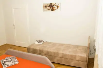 a living room with a bed and a couch at See U in Belgrade in Belgrade