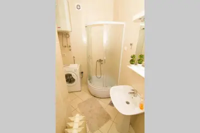 a white bathroom with a sink and a toilet at See U in Belgrade in Belgrade