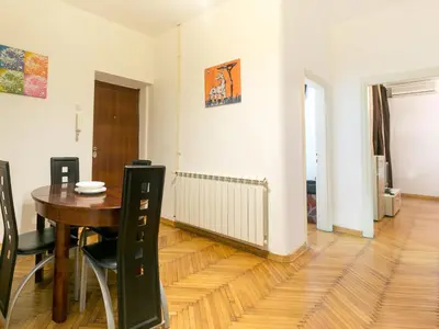 a dining room with a table and chairs at Apartment Marsal in Belgrade