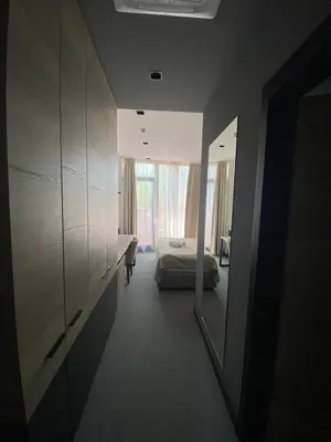 a bedroom with a bed and a large window at Super seven inn in Belgrade