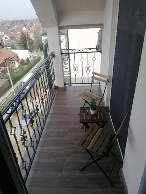 a balcony with a bench and a view at Nenadovic Apartman in Obrenovac