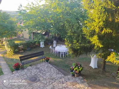 a park with a table and chairs under a tree at Dečiji vinogradi Belgrade, Sopot, Kosmaj in Sopot